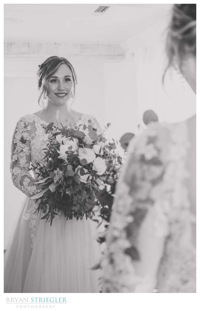 bride looking in mirror